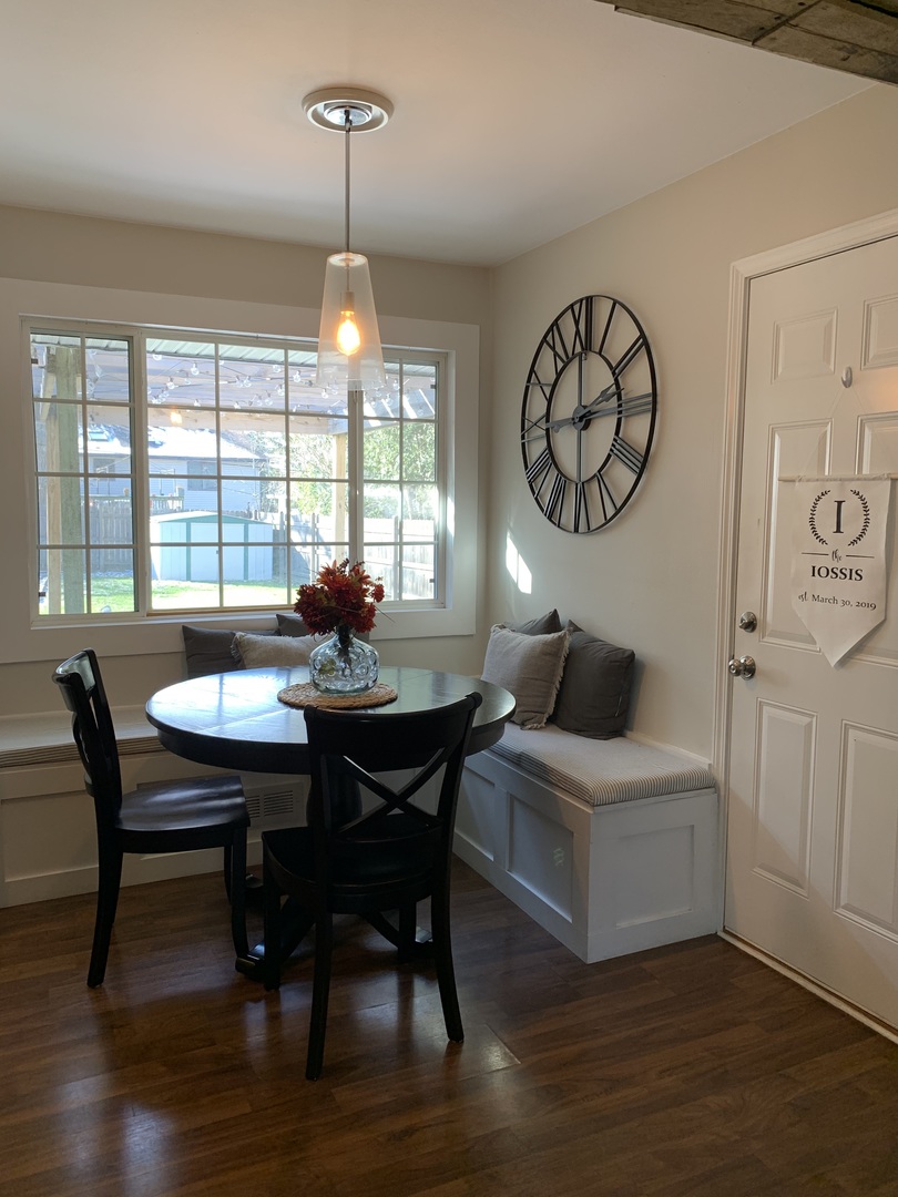2119 Fairfield Road Lindenhurst, IL 60046 - Photo 6 of 22 a view of a dining room with furniture window and wooden floor