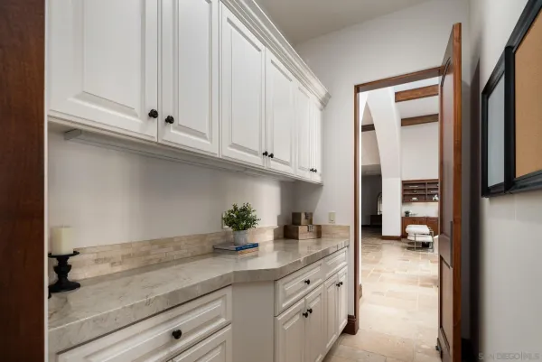 a kitchen with a sink and cabinets