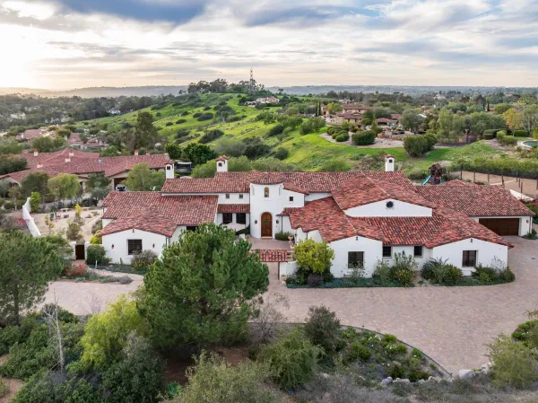 an aerial view of multiple houses with yard