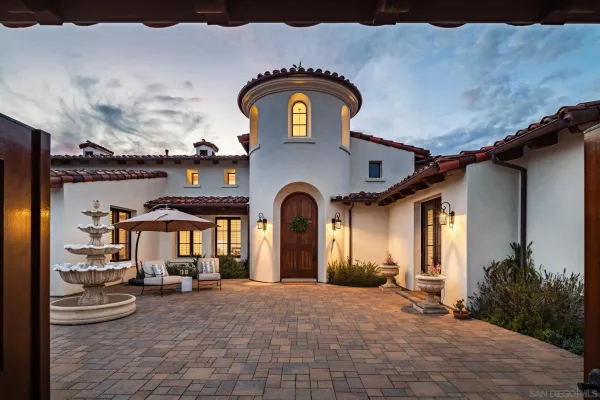 a view of a house with a yard and plants