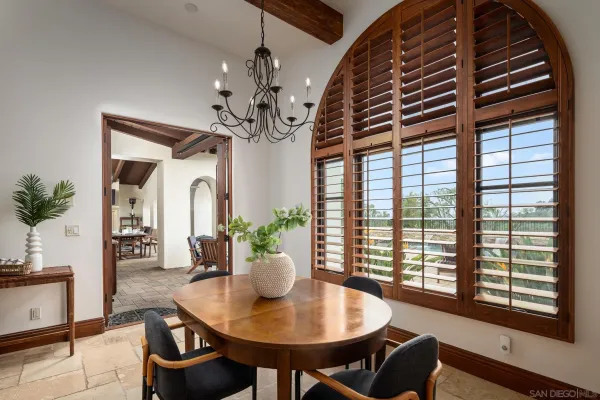 a dining room with furniture and window