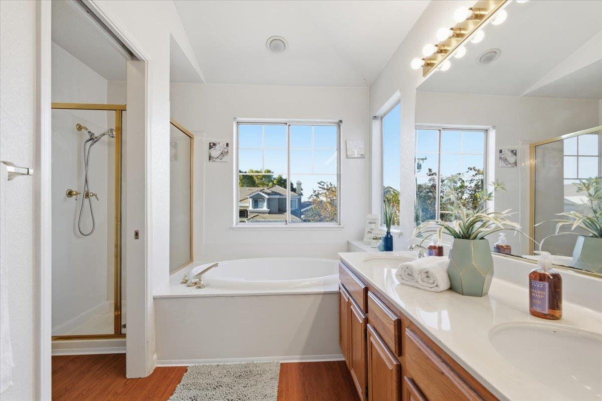 29273 Chance Street Hayward, CA 94544 - Photo 24 of 51 a bathroom with a tub a sink and a large mirror