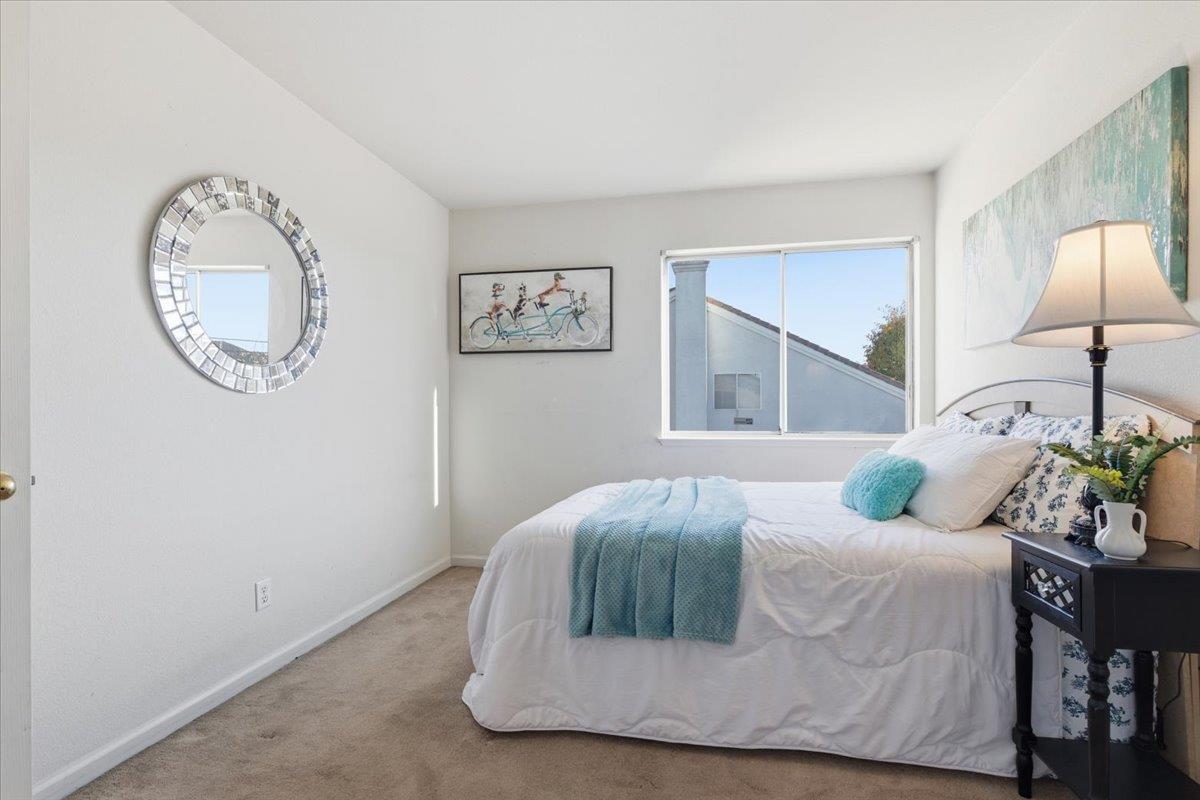 29273 Chance Street Hayward, CA 94544 - Photo 30 of 51 a bedroom with a bed and a lamp on dresser