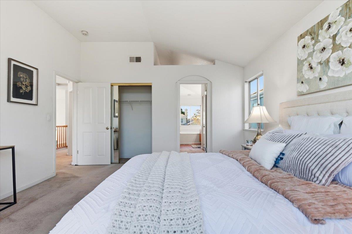 29273 Chance Street Hayward, CA 94544 - Photo 33 of 51 a bedroom with a large bed and a chandelier