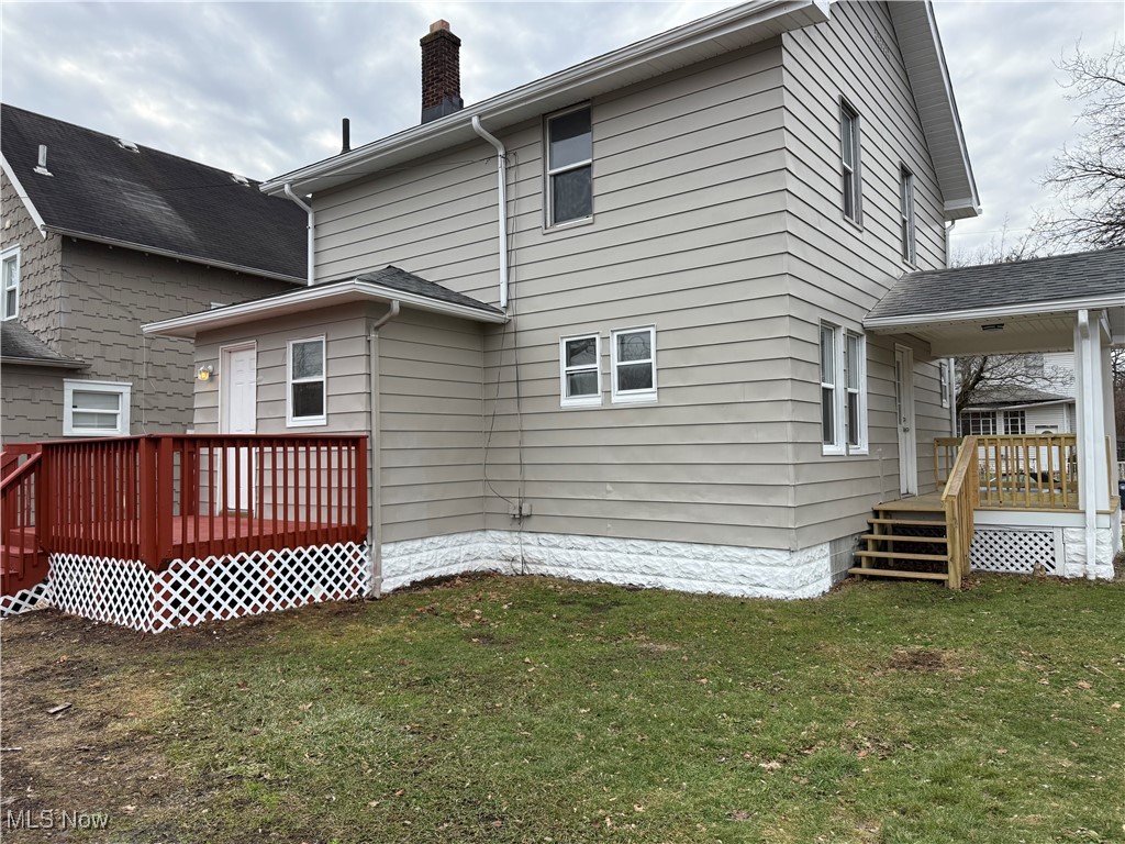 1013 Berwin Street Akron, OH 44310 - Photo 3 of 13 Rear view of property featuring a wooden deck and a yard