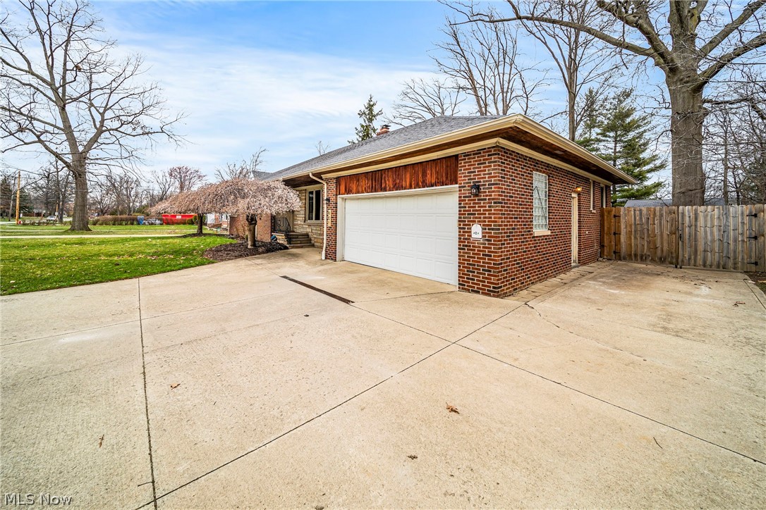 901 Lloyd Road Wickliffe, OH 44092 - Photo 29 of 40 Garage featuring a lawn