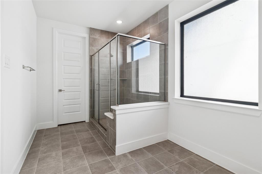 714 Resort Drive Rowlett, TX 75088 - Photo 13 of 30 a bathroom with a shower and a sink
