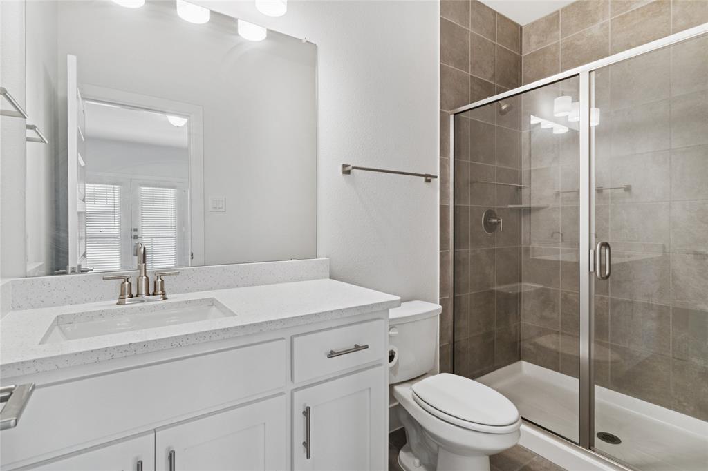 714 Resort Drive Rowlett, TX 75088 - Photo 15 of 30 a bathroom with a sink toilet and shower