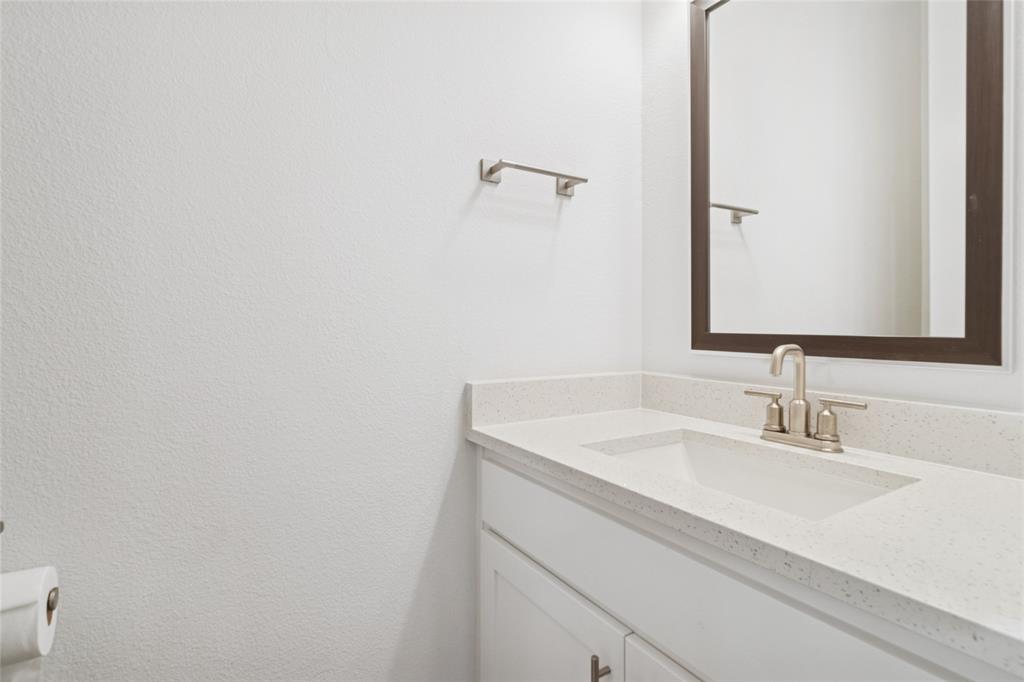 714 Resort Drive Rowlett, TX 75088 - Photo 16 of 30 a bathroom with a sink and a mirror