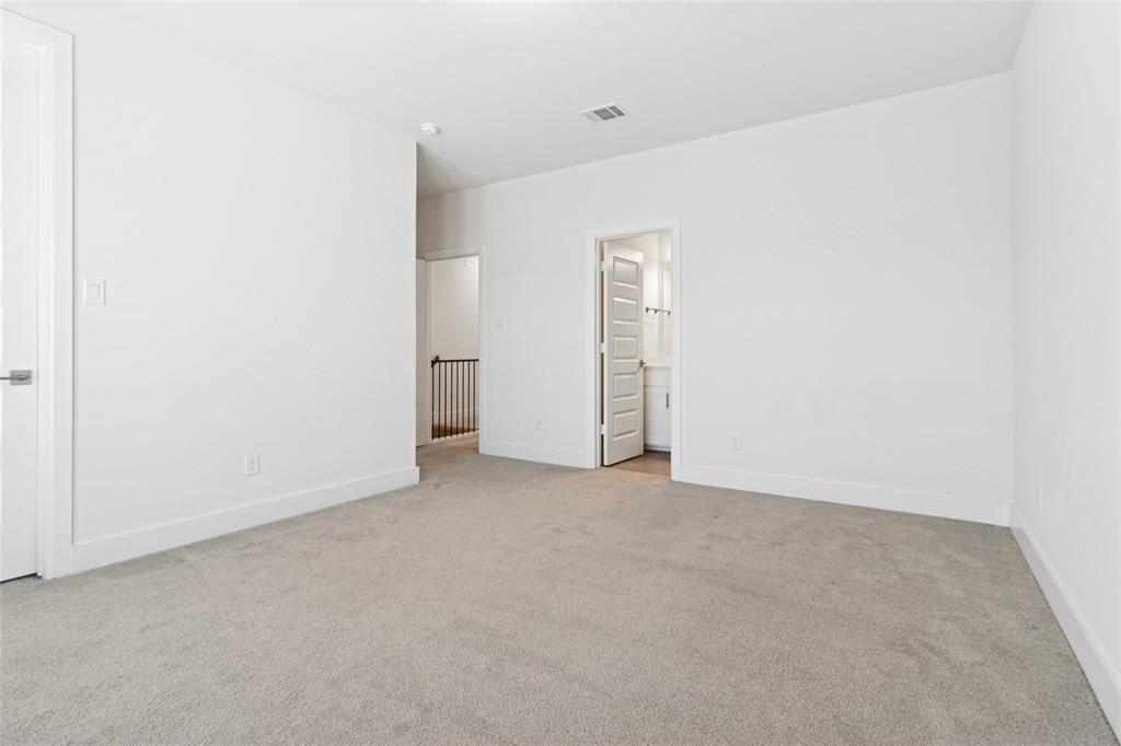 714 Resort Drive Rowlett, TX 75088 - Photo 18 of 30 an empty room with windows