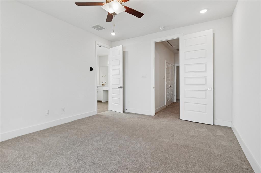 714 Resort Drive Rowlett, TX 75088 - Photo 19 of 30 an empty room with a ceiling fan and entryway