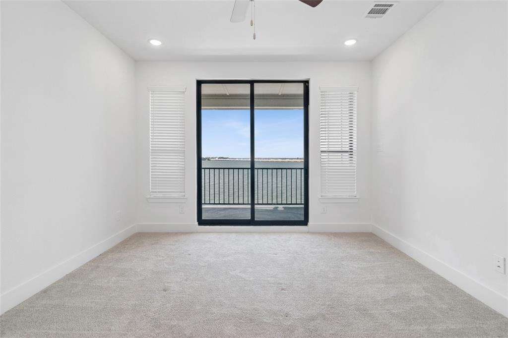714 Resort Drive Rowlett, TX 75088 - Photo 20 of 30 an empty room with sliding door and windows