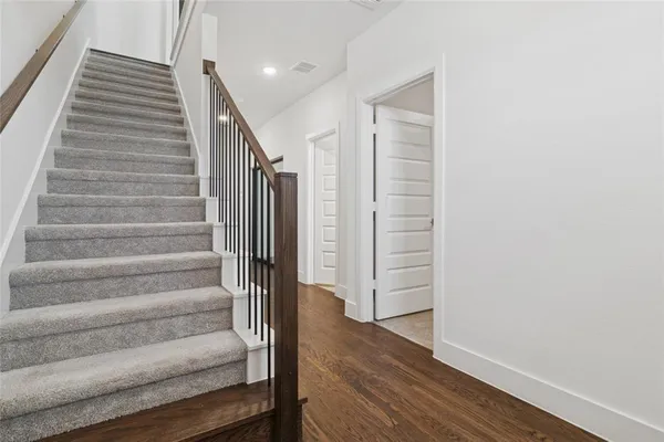 a view of entryway with wooden floor