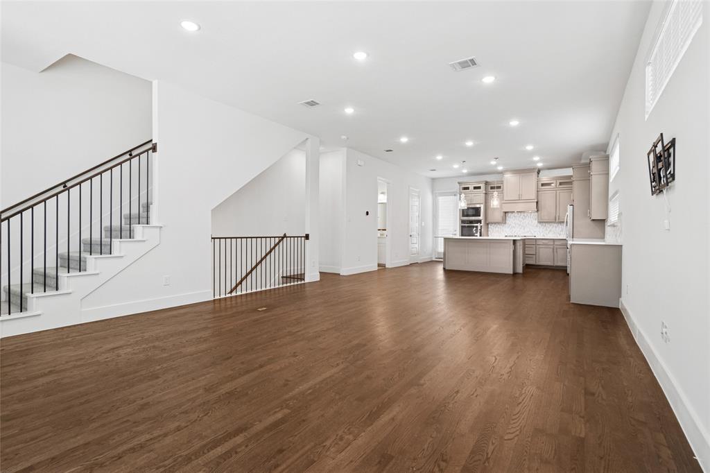 714 Resort Drive Rowlett, TX 75088 - Photo 4 of 30 a view of kitchen and hall with wooden floor