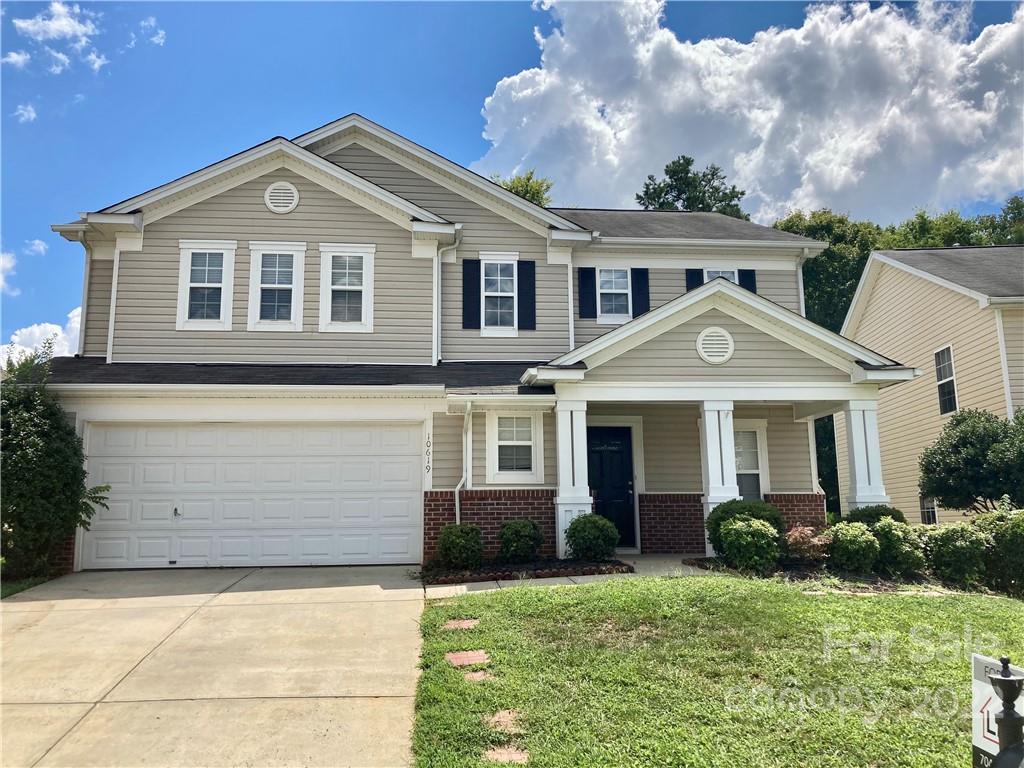 10619 Bedlington Road Charlotte, NC 28278 - Photo 1 of 26 front view of a house with a yard