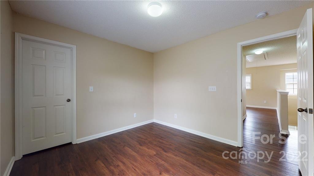 10619 Bedlington Road Charlotte, NC 28278 - Photo 18 of 26 wooden floor in an empty room