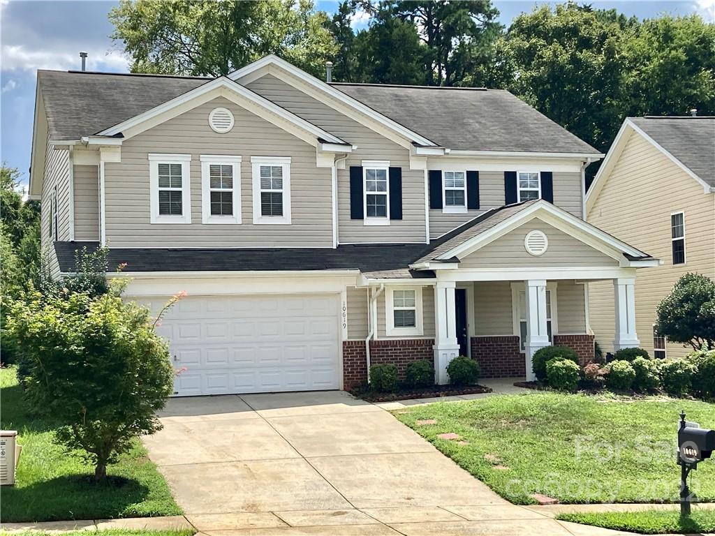 10619 Bedlington Road Charlotte, NC 28278 - Photo 2 of 26 a front view of a house with a yard