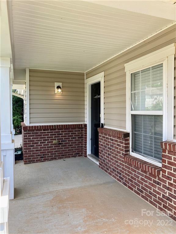 10619 Bedlington Road Charlotte, NC 28278 - Photo 3 of 26 a side view of a house with large windows