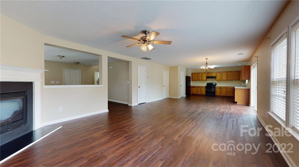 10619 Bedlington Road Charlotte, NC 28278 - Photo 6 of 26 a view of kitchen with furniture and wooden floor