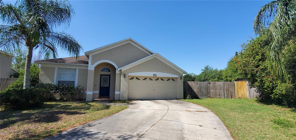1712 Open Field Loop Brandon, FL 33510 - Photo 1 of 1 a front view of a house with a garden