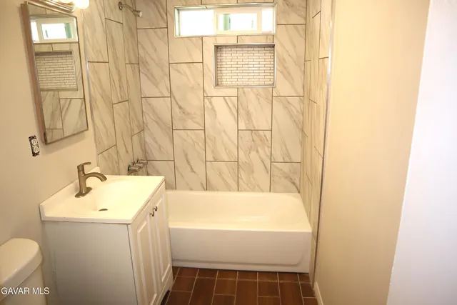 a bathroom with a sink and a bathtub