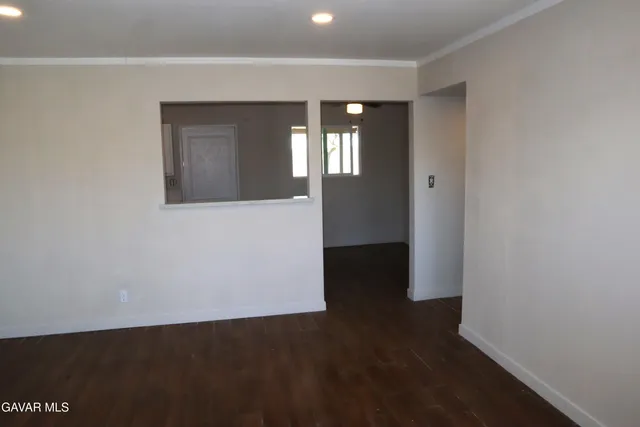 a view of hallway with wooden floor