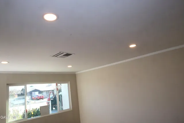 a view of a room with lots of stuff and hardwood floor