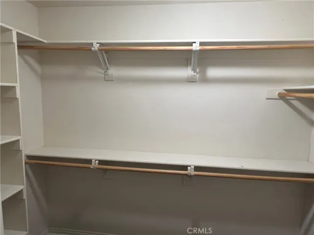 a white toilet sitting next to a shower