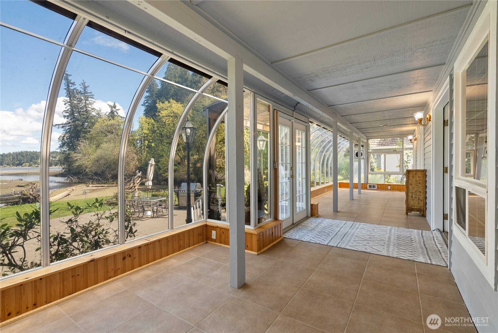 8320 East Grapeview Loop Road Allyn, WA 98524 - Photo 15 of 38 a building outdoor space with seating