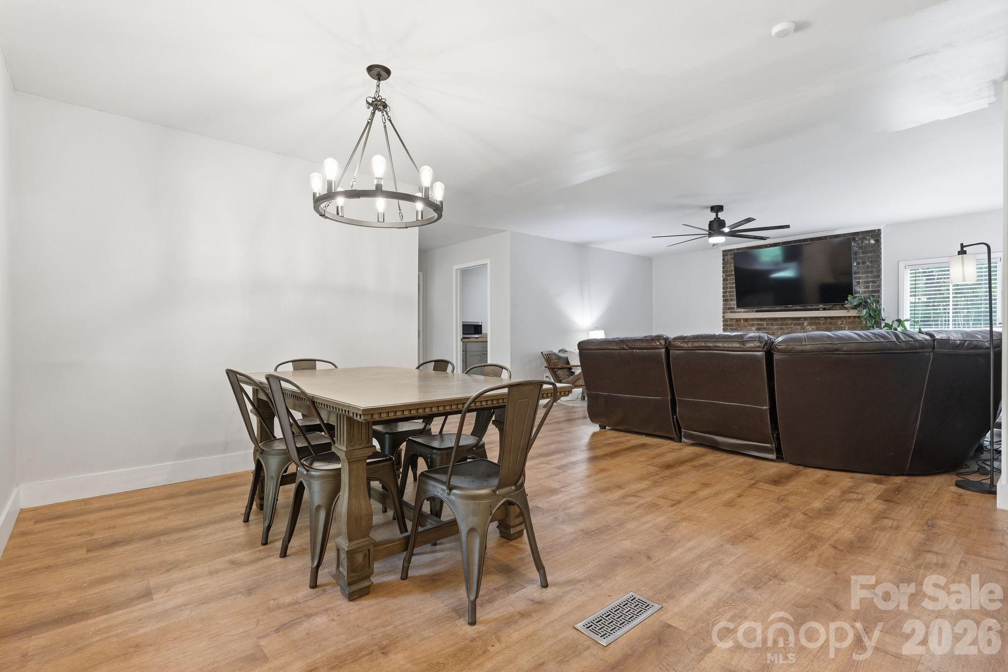 5347 Haney Road York, SC 29745 - Photo 10 of 39 a view of a dining room with furniture wooden floor and chandelier