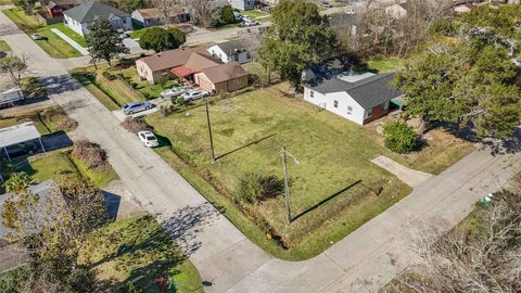 an aerial view of a house with a swimming pool