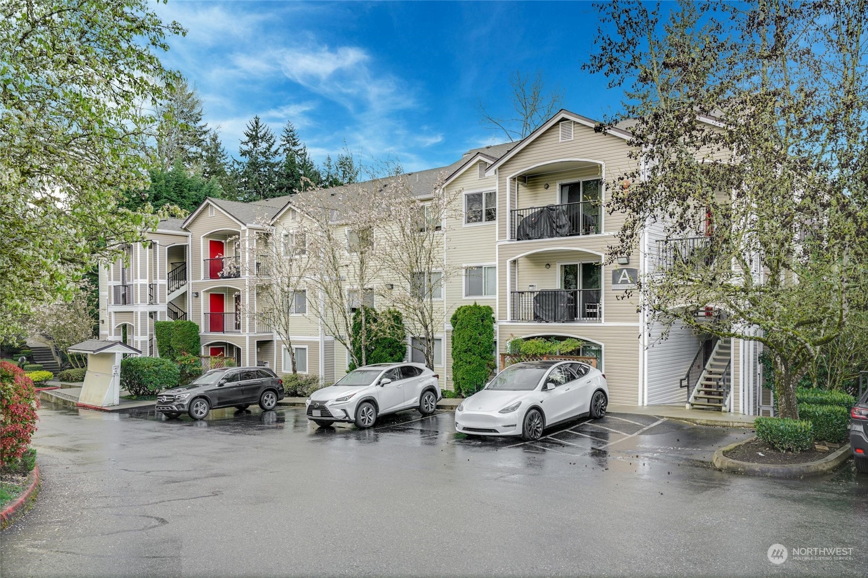 10709 Valley View Road, Unit A303 Bothell, WA 98011 - Photo 1 of 23 a car parked in front of a white house
