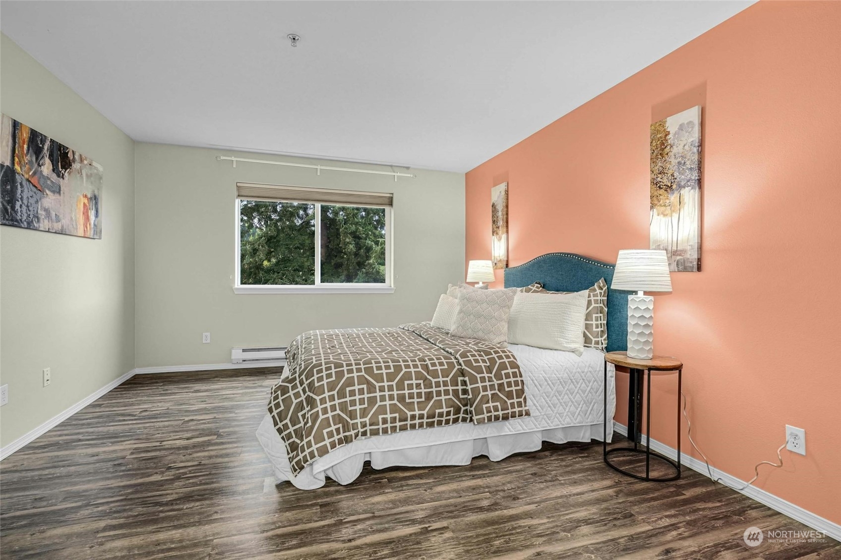 10709 Valley View Road, Unit A303 Bothell, WA 98011 - Photo 11 of 23 a bedroom with a bed and wooden floor
