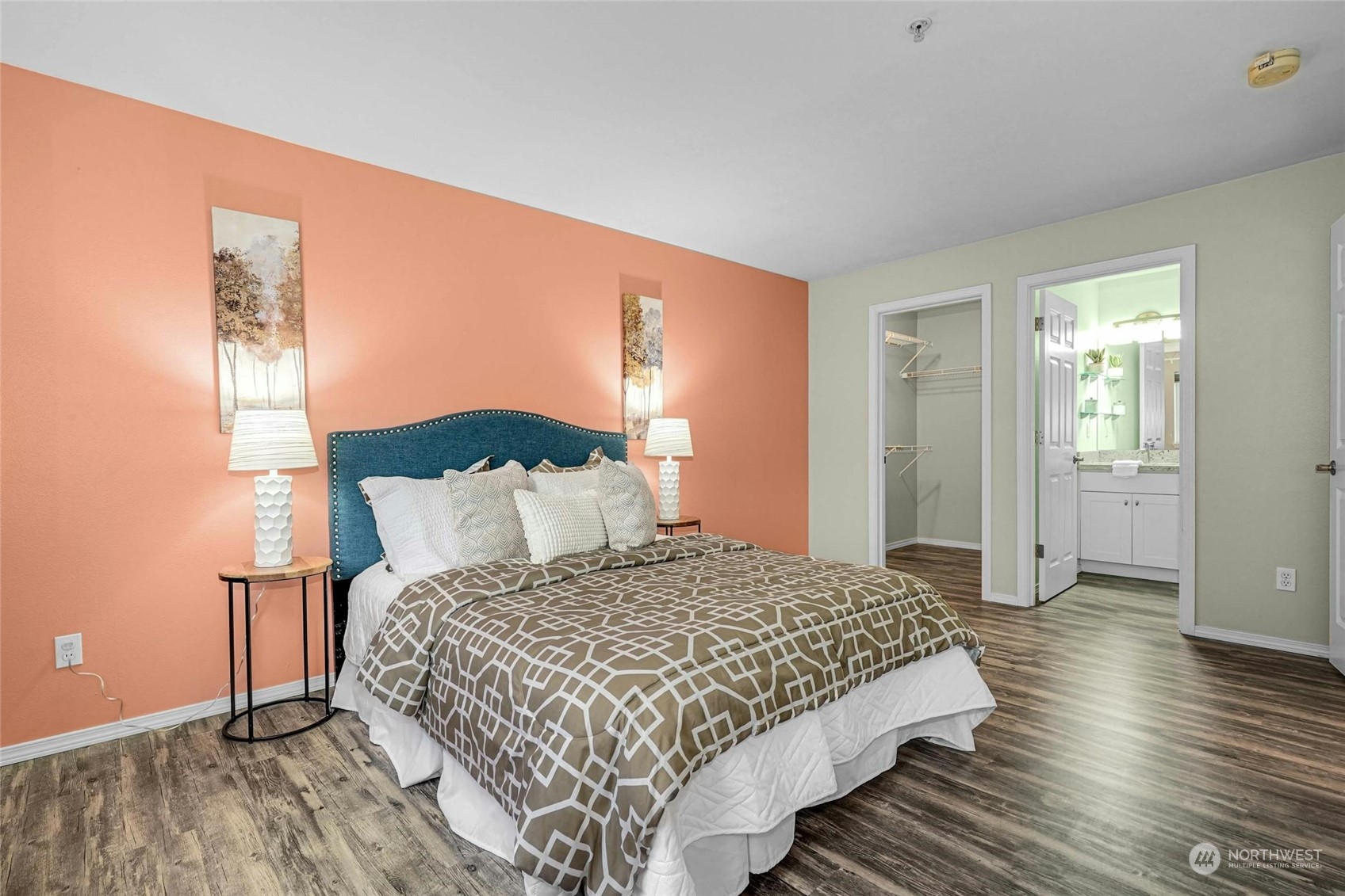 10709 Valley View Road, Unit A303 Bothell, WA 98011 - Photo 12 of 23 a bedroom with a bed and wooden floor