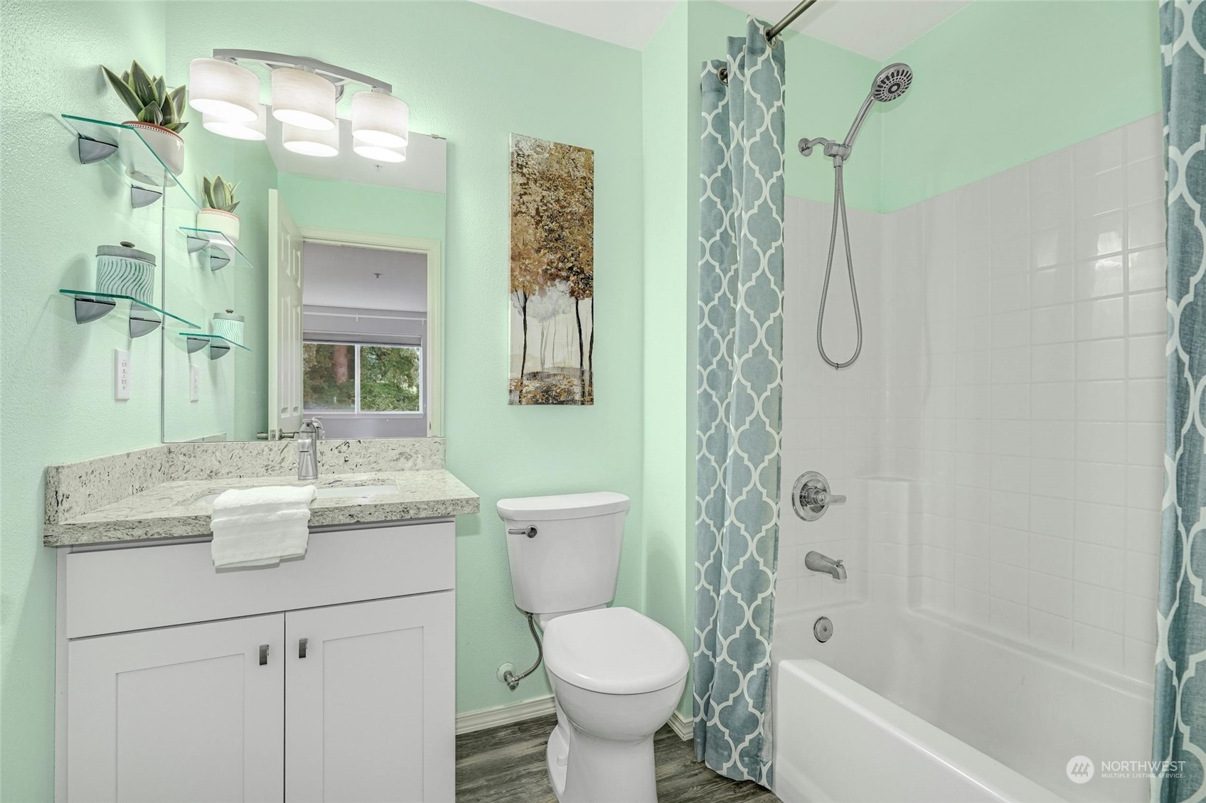 10709 Valley View Road, Unit A303 Bothell, WA 98011 - Photo 13 of 23 a bathroom with a granite countertop sink toilet and shower