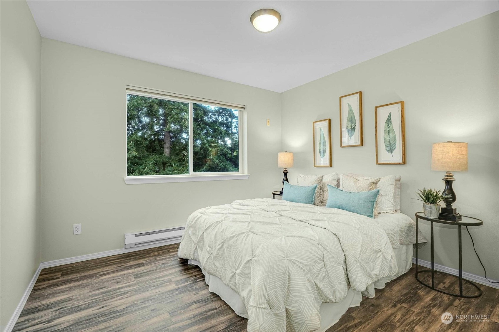 10709 Valley View Road, Unit A303 Bothell, WA 98011 - Photo 15 of 23 a bedroom with a bed and a window