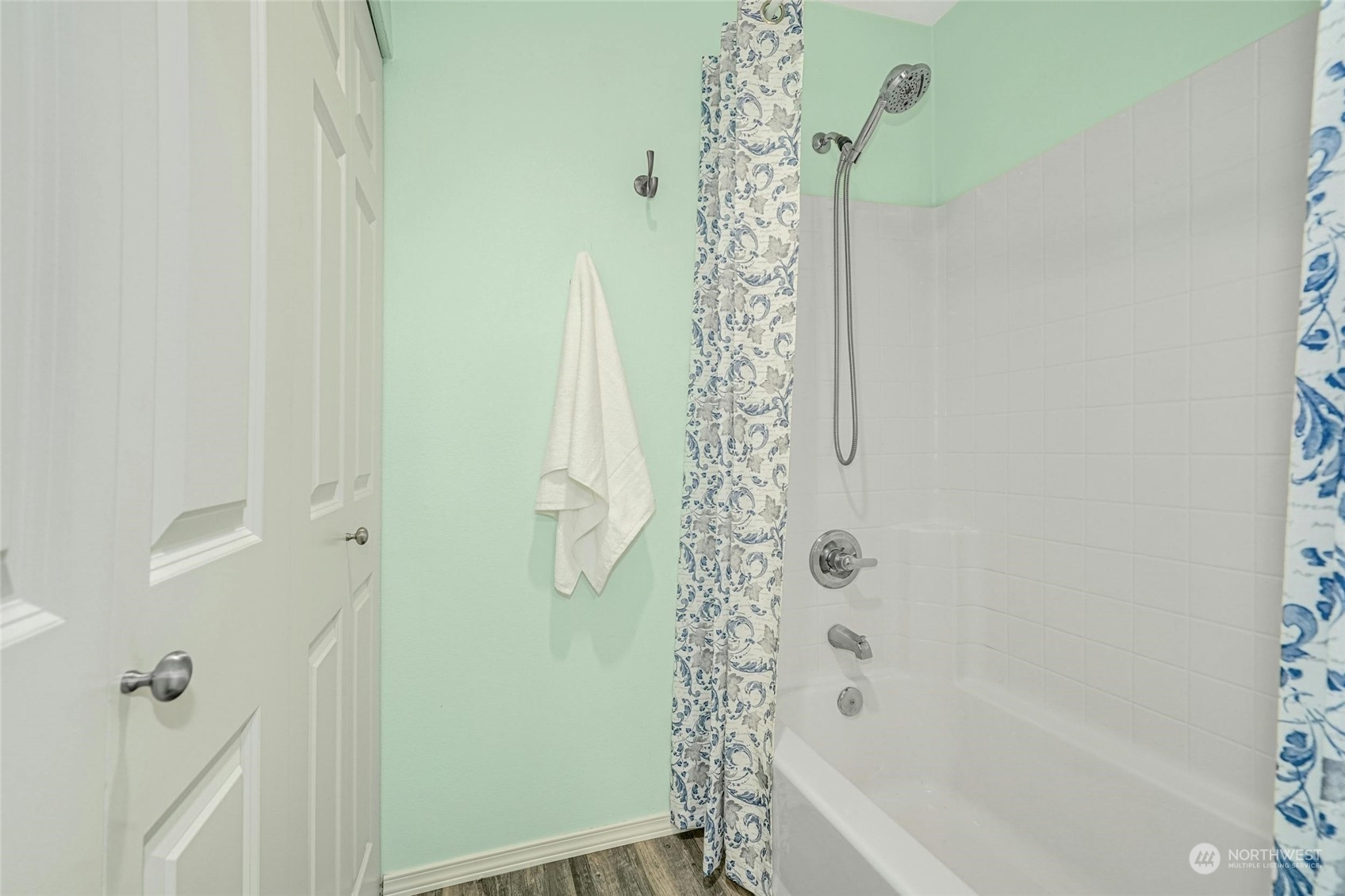 10709 Valley View Road, Unit A303 Bothell, WA 98011 - Photo 16 of 23 a bathroom with a shower curtain and a bathtub