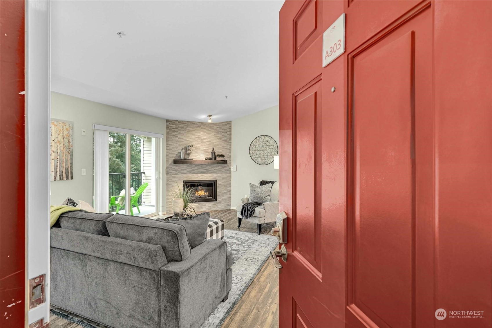 10709 Valley View Road, Unit A303 Bothell, WA 98011 - Photo 2 of 23 a living room with furniture and a fireplace