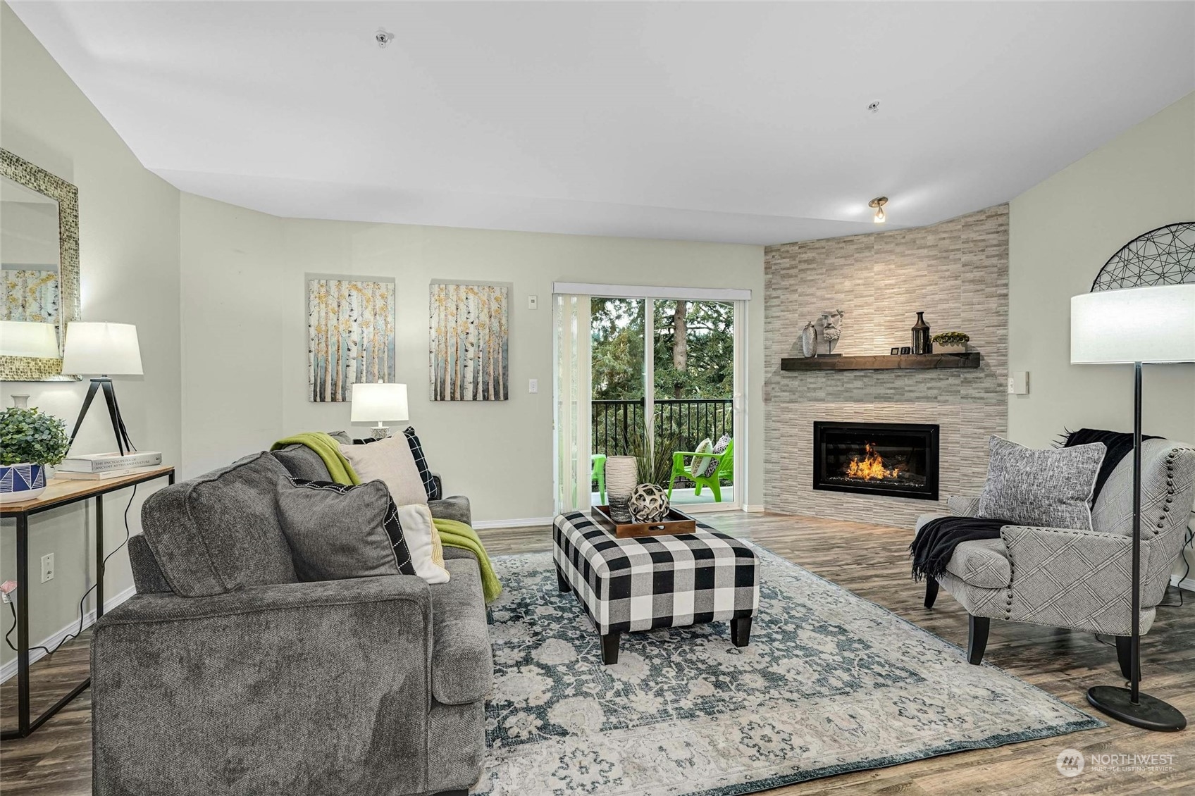 10709 Valley View Road, Unit A303 Bothell, WA 98011 - Photo 3 of 23 a living room with furniture and a fireplace