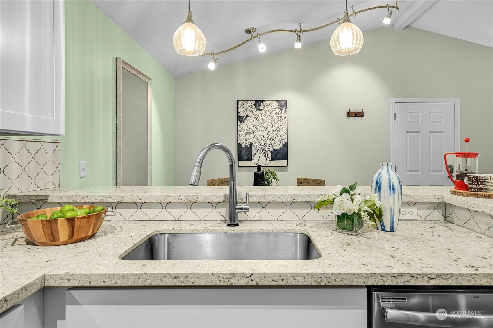 10709 Valley View Road, Unit A303 Bothell, WA 98011 - Photo 10 of 23 a kitchen with a granite countertop sink and a mirror