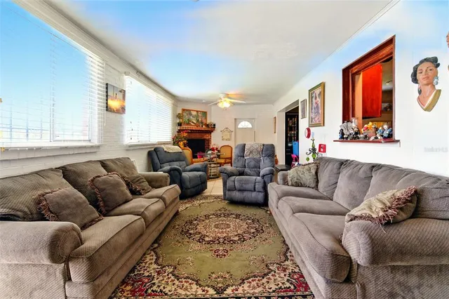 a living room with furniture granite countertop and a couch