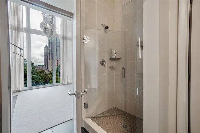 a bathroom with a glass shower door