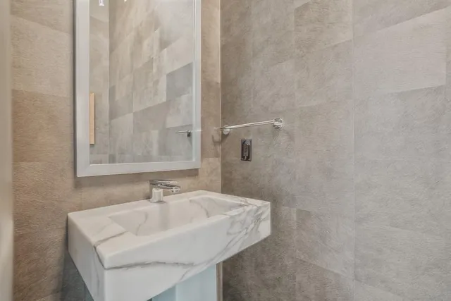 a bathroom with a sink and a mirror