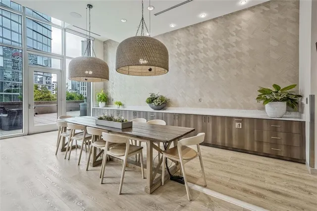 a view of a dining room with furniture window and wooden floor