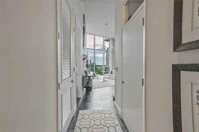 a view of a hallway with a dining room