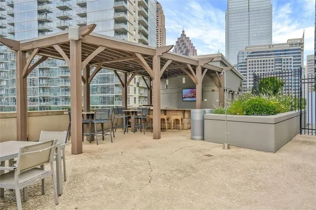 a view of a chairs and table in a patio