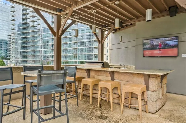 a dining table with chairs and window
