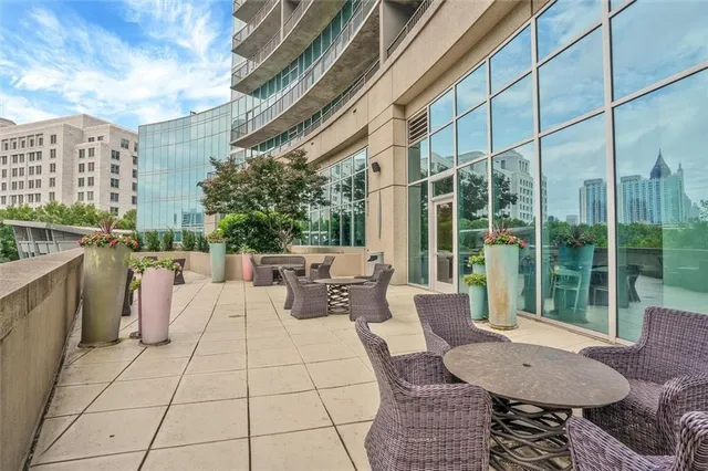 a outdoor space with the couches and dining table chair