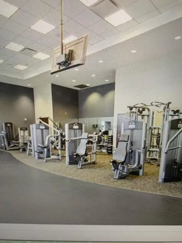 a room with lots of gym equipment