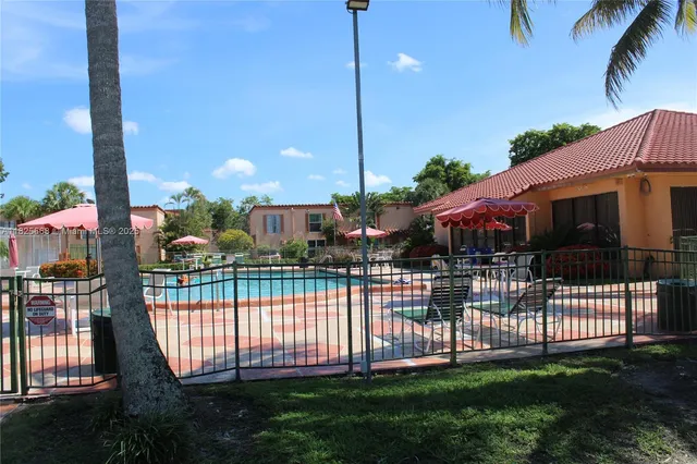a view of a balcony with sitting area